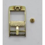 Omega gold plated buckle and Omega crown winder. P&P Group 1 (£14+VAT for the first lot and £1+VAT