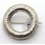 Vintage presumed silver engraved circular brooch, D: 40 mm. P&P Group 1 (£14+VAT for the first lot