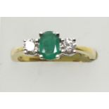 18ct gold emerald and diamond three stone ring, diamonds totalling approximately 0.40ct, emerald