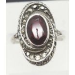 935 silver oval marcasite and red stone set ring, size N. P&P Group 1 (£14+VAT for the first lot and