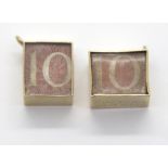 Two 9ct gold bound ten shilling note charms. P&P Group 1 (£14+VAT for the first lot and £1+VAT for