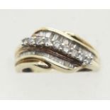 9ct gold diamond ring, set with two rows of baguette diamonds and nine round cut diamonds