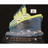 Large cast iron Titanic doorstop H: 26 cm. P&P Group 2 (£18+VAT for the first lot and £2+VAT for