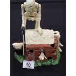 Cast iron skeleton cutter moneybox H: 23 cm. P&P Group 2 (£18+VAT for the first lot and £2+VAT for