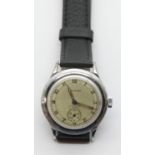 Gents vintage Swiss steel cased waterproof wristwatch having a champagne coloured dial and