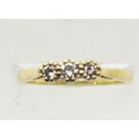 Modern 18ct gold three stone diamond ring, size N, 2.7g. P&P Group 1 (£14+VAT for the first lot