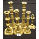 Two pairs of brass candlesticks and two others. P&P Group 2 (£18+VAT for the first lot and £2+VAT