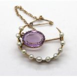 Victorian (presumed gold) ladies seed pearl and amethyst crescent brooch with safety chain. P&P