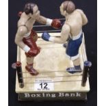 Cast iron boxing moneybox H: 23 cm. P&P Group 2 (£18+VAT for the first lot and £2+VAT for subsequent