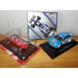 Two F1 race cars and a touring car race car. P&P Group 2 (£18+VAT for the first lot and £2+VAT for