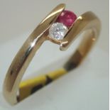 9ct gold, ruby and diamond twist ring size N/O 2.9g. P&P group 1 (£16 for the first item and £1.50