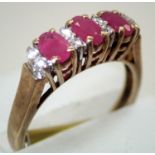 Ladies 9ct gold three stone ruby and diamond ring. P&P group 1 (£16 for the first item and £1.50 for