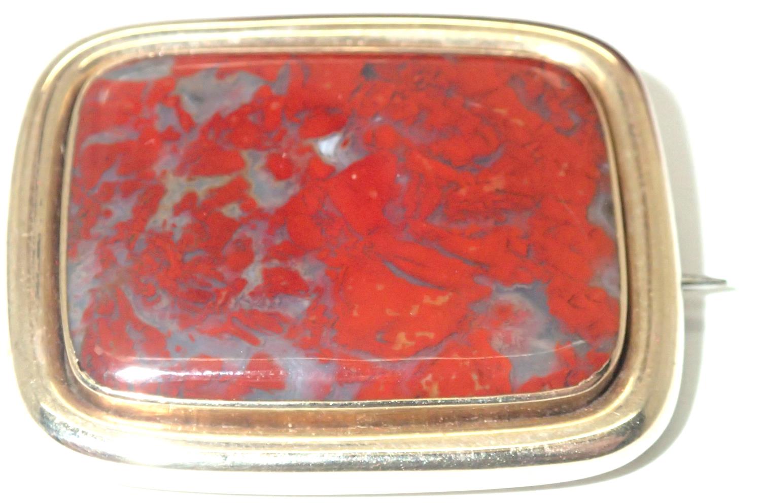 A boxed large Victorian mourning brooch, rectangular form having a large panel of agate, and