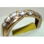 Ladies 9ct gold seven stone on a twist diamond ring. P&P group 1 (£16 for the first item and £1.50