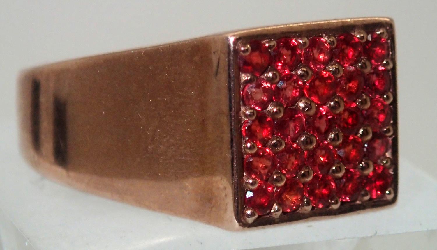 Gents 9ct rose gold 25 set garnet ring size W. P&P group 1 (£16 for the first item and £1.50 for