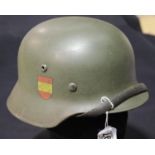 German WWII style helmet with liner and chinstrap. P&P Group 2 (£18+VAT for the first lot and £2+VAT