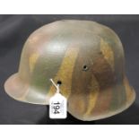 German WWII style helmet with damage to crown, lacking liner and chinstrap. P&P Group 2 (£18+VAT for