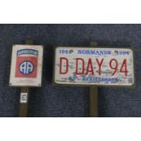 Two lawn stake signs with American signs for 82nd Airborne Division and D-Day 90th anniversary. P&
