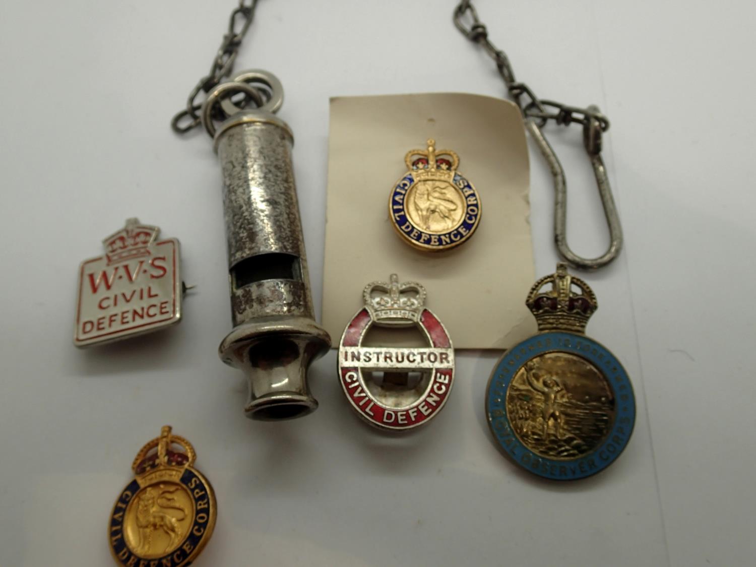 WWII period and later Home Front badges and an ARP whistle. P&P Group 1 (£14+VAT for the first lot