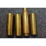 Three 27 mm brass cartridges marked K Limited and a machine gun bullet case. P&P Group 1 (£14+VAT