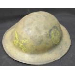 WWI type British Brodie helmet with liner and chinstrap with painted luck horseshoe decoration. P&