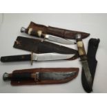 Two horn handled Sheffield sheath knives and two further examples. P&P Group 3 (£25+VAT for the