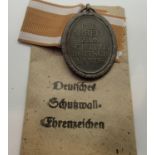 WWII German style West Wall medal, unissued in original packet. P&P Group 1 (£14+VAT for the first