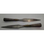 Two hand crafted spear heads with brass and copper mounts, L: 19 cm. P&P Group 2 (£18+VAT for the