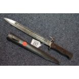 Wooden handled bayonet with steel scabbard, impressed characters to the blade, L: 38 cm, blade L: 25