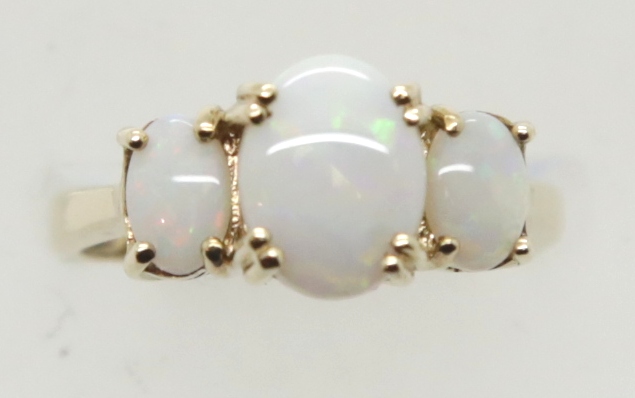 Modern 9ct gold three stone opal ring, size L, 3.4g. P&P Group 1 (£14+VAT for the first lot and £1+