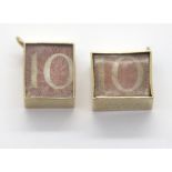 Two 9ct gold bound ten shilling note charms. P&P Group 1 (£14+VAT for the first lot and £1+VAT for