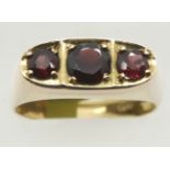 9ct gents three stone garnet gypsy style ring, size V, 4.7g. P&P Group 1 (£14+VAT for the first