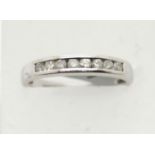 9ct white gold diamond channel set half eternity ring, size L, 2.5g. P&P Group 1 (£14+VAT for the
