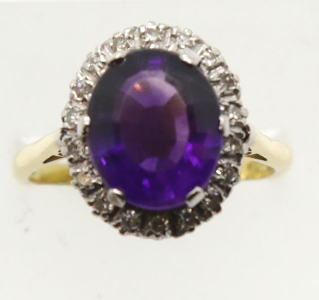 18ct gold large amethyst and diamond set cluster ring, size Q, 6.6g. P&P Group 1 (£14+VAT for the