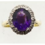 18ct gold large amethyst and diamond set cluster ring, size Q, 6.6g. P&P Group 1 (£14+VAT for the