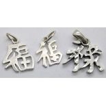 Three silver Chinese symbol charms. P&P Group 1 (£14+VAT for the first lot and £1+VAT for subsequent