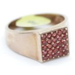 Gents 9ct rose gold pave set garnet ring, size V. P&P Group 1 (£14+VAT for the first lot and £1+