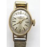 Ladies Tissot 9ct gold wristwatch on a plated bracelet with papers. P&P Group 1 (£14+VAT for the