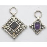 Two silver stone set pendants (one garnet, one amethyst). P&P Group 1 (£14+VAT for the first lot and