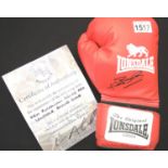 Ken Buchanan signed red Lonsdale boxing glove with CoA from Montage Moments. P&P Group 2 (£18+VAT