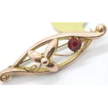 Antique stone set rose gold brooch. P&P Group 1 (£14+VAT for the first lot and £1+VAT for subsequent