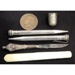 Two Eversharp silver plated pencils, an antique ivory letter clip, a silver thimble and a small