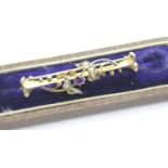 Cased 9ct gold amethyst and seed pearl brooch one pearl missing L: 42 mm 2.0g. P&P Group 1 (£14+