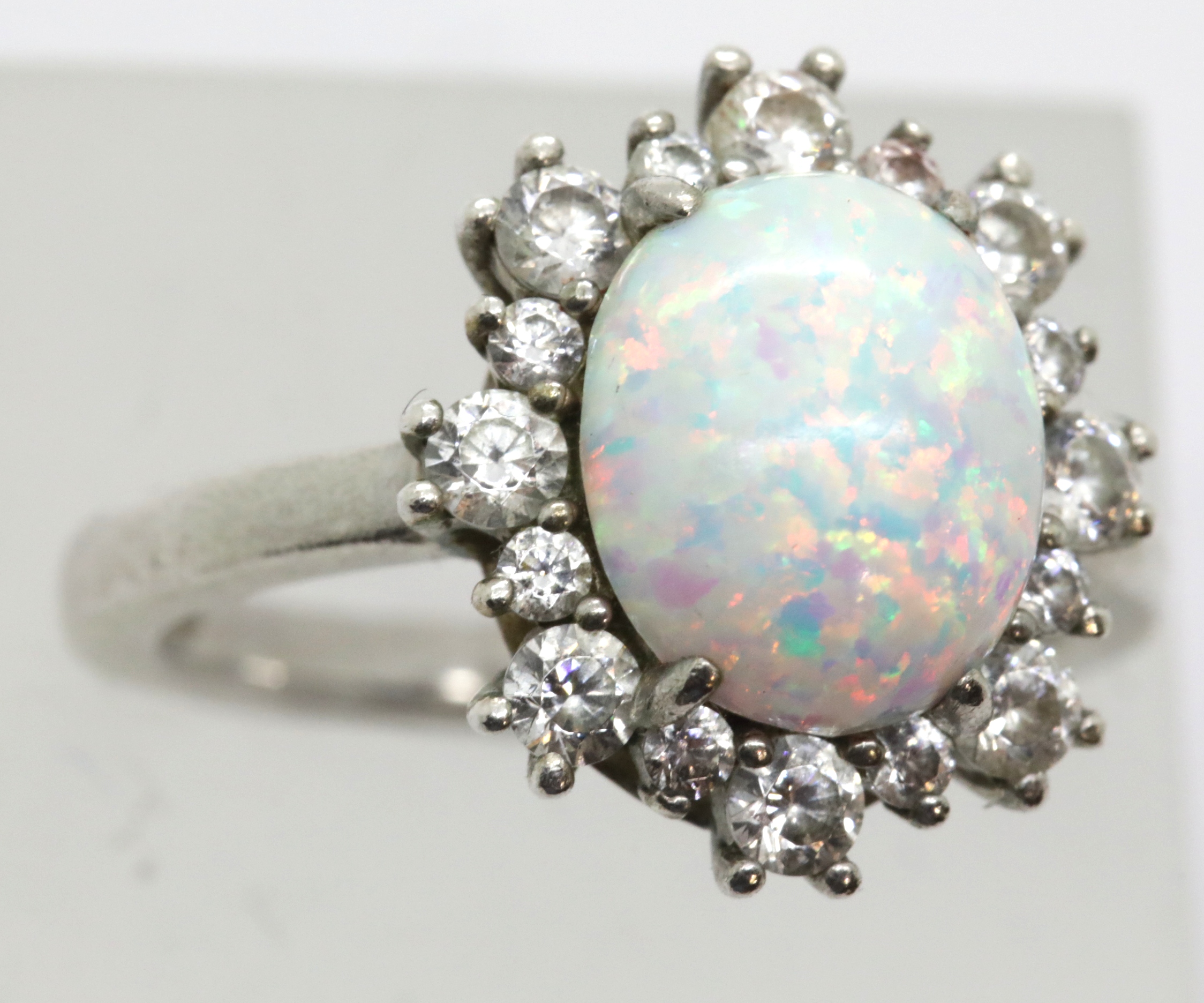 925 silver opal and white stone ring, size U, 6.6g. P&P Group 1 (£14+VAT for the first lot and £1+