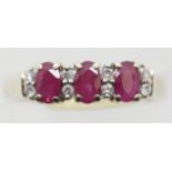 70s style three stone ruby and diamond fancy ring, size O, 3.0g. P&P Group 1 (£14+VAT for the