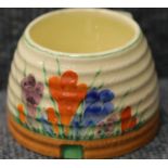 Clarice Cliff pot in the Crocus pattern, D: 9 cm. P&P Group 1 (£14+VAT for the first lot and £1+
