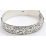 Ladies vintage 18 mm wide, very heavy engraved hinge bangle, 49g. P&P Group 1 (£14+VAT for the first