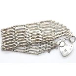 Silver heavy eight bar fancy gate bracelet with padlock. P&P Group 1 (£14+VAT for the first lot