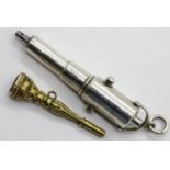 Two fancy pocket watch keys, one a large white metal example and the other in yellow metal with an