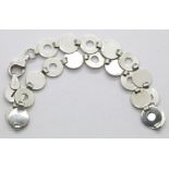 Ladies silver circular design bracelet. P&P Group 1 (£14+VAT for the first lot and £1+VAT for